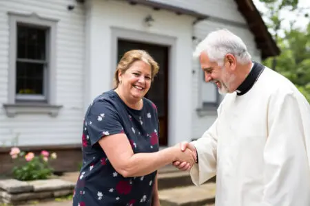 prikaz srdačnog i poštovanja punog rukovanja s katoličkim svećenikom što ilustrira kako pozdraviti svećenika